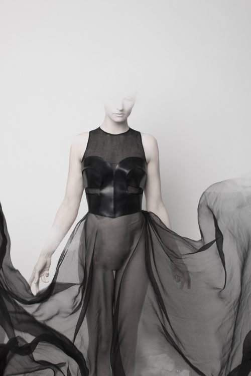 Nude model in Nicoline Hansen Corset top in latex with chiffon billowing as a skirt